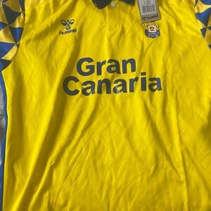 Hummel Yellow and Blue Soccer Jersey There are 5 shirts at 70 each.